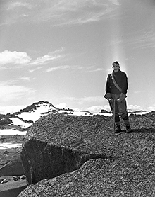 Dr King standing on one of the holy mountains in Australia Dr King standing on one of the holy mountains
