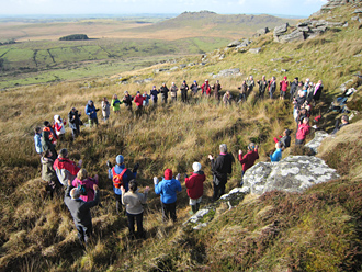 Pilgrims in prayer on Brown Willy, the holy mountain in Cornwall, England